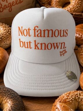 Brand new POP UP BAGELS NOT FAMOUS BUT KNOWN white orange trucker hat